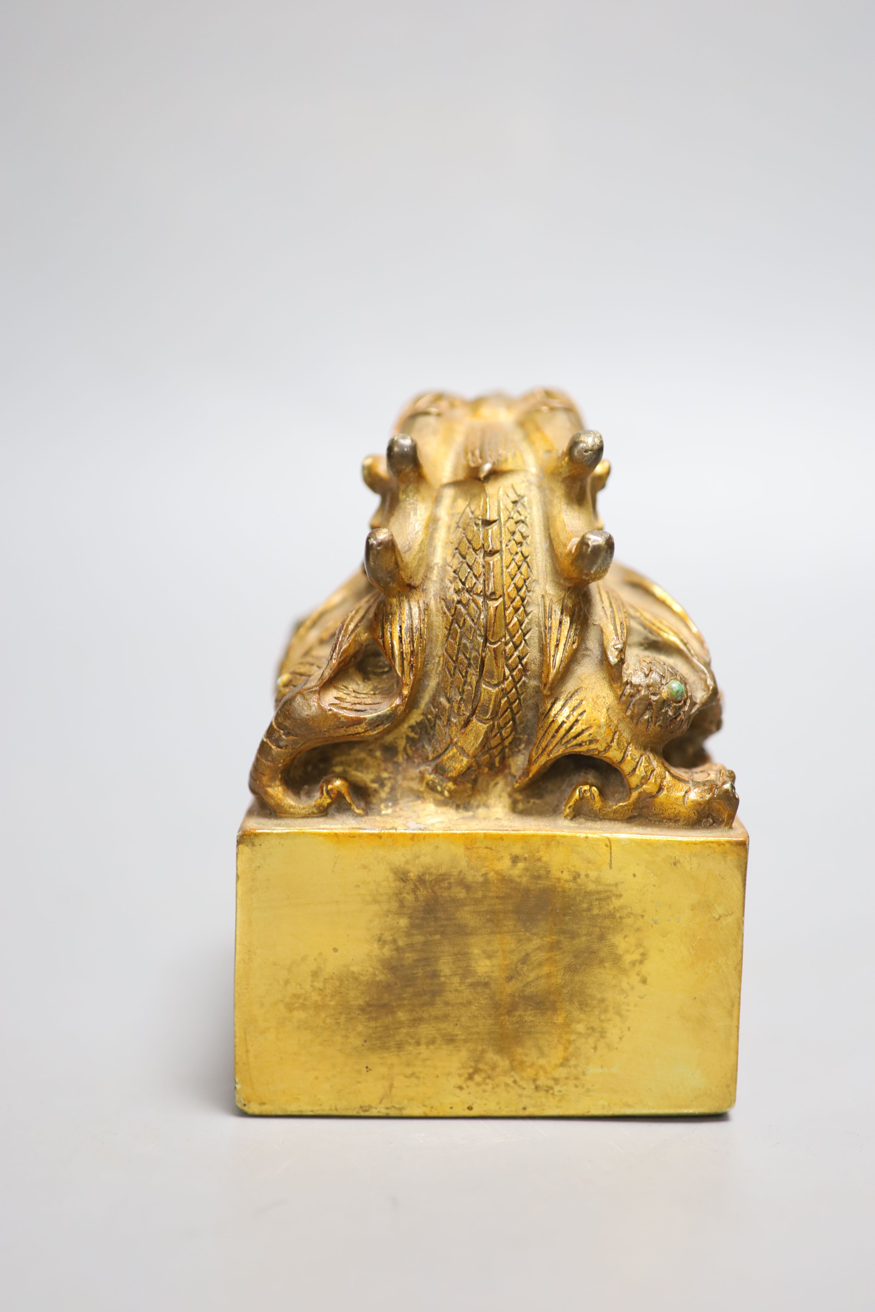 A Chinese gilt bronze dragon seal, height 13cm